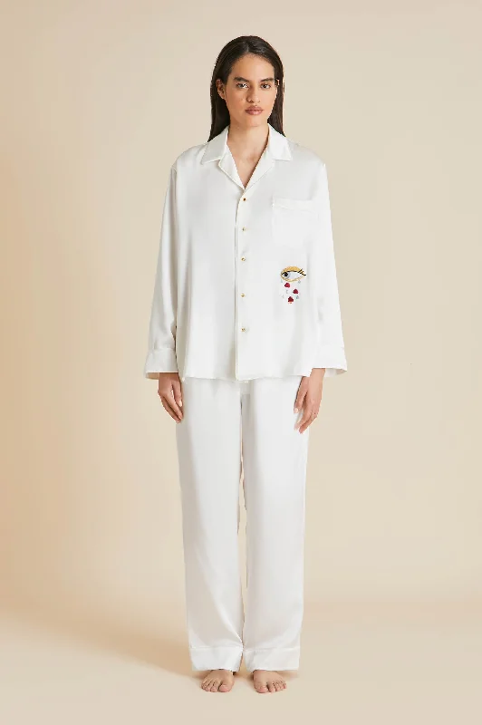 Yves Desire Ivory pajamas in Silk with Ruby and Diamond Buttons by Jessica McCormack